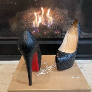 Beautiful Black Christian Louboutin size 38 snake skin heels!